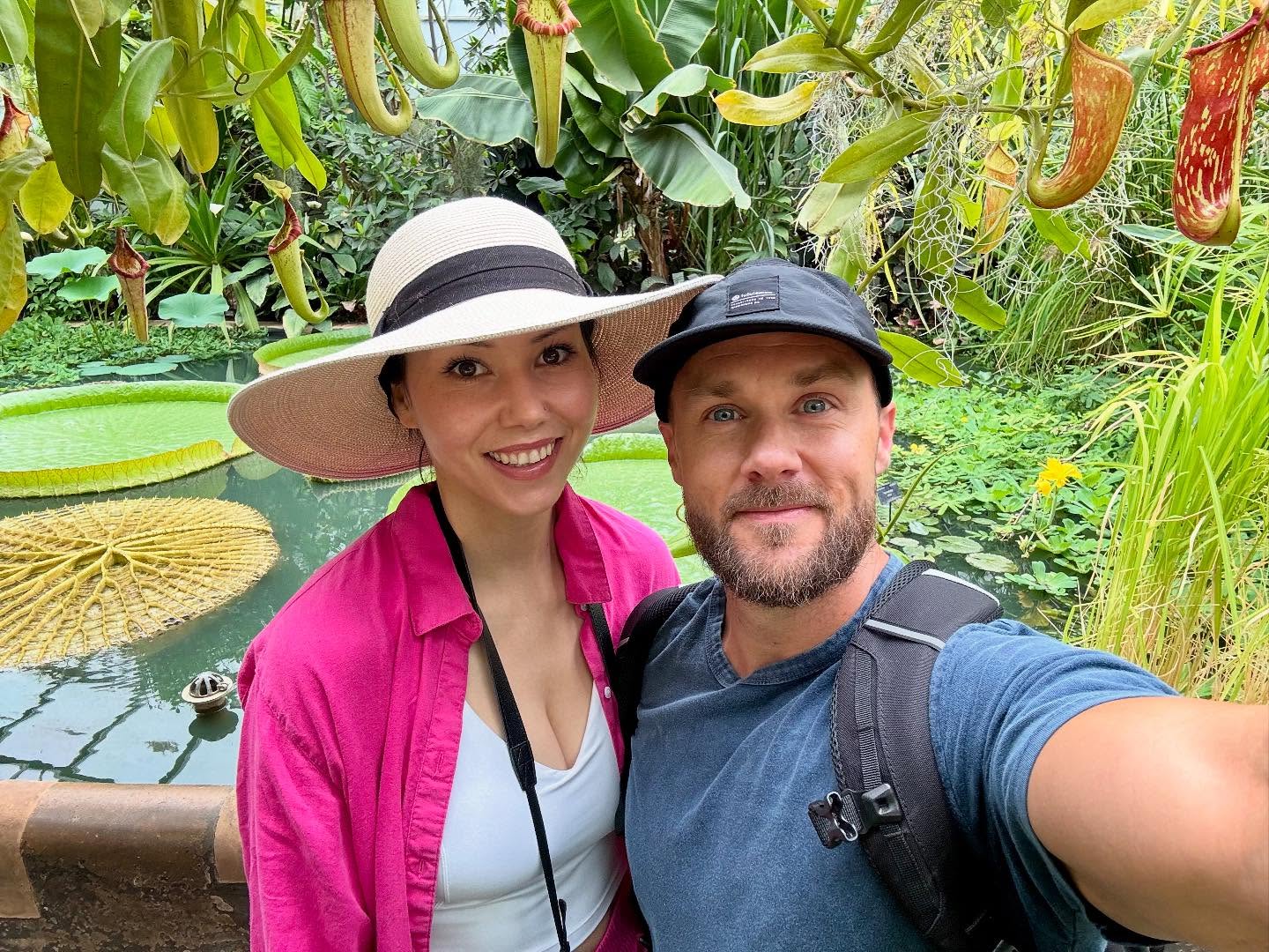 Derek Simnett and Crystal exploring a tropical botanical garden